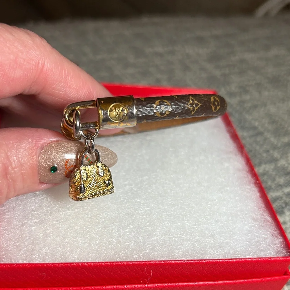 267. Louis Vuitton Monogram Alma Charm Bracelet with COA